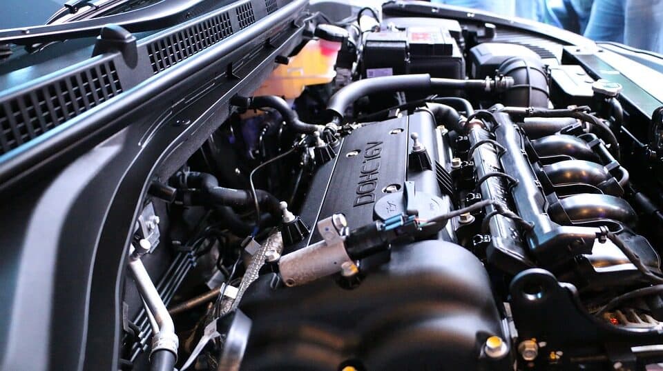 Mechanic working on a vehicle engine at Lincs Auto Solutions